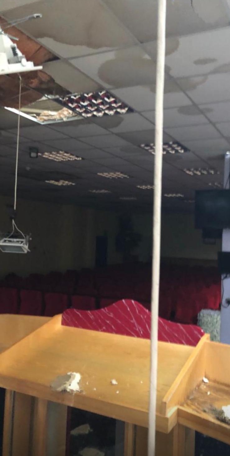 Water-damaged ceiling, community hall